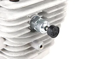 A close-up view of a pressure reducing valve installed on a finned metal RC engine cylinder head.