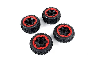Four Rovan Baja 5B RC buggy wheels with black knobby wasteland tires and red beadlock rims arranged on a white background.
