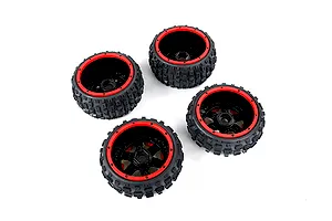 Four Rovan Baja 5B RC buggy wheels with black knobby tires and red beadlock-style rims arranged on a white background.