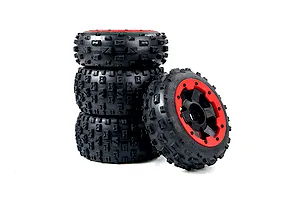 A set of four Rovan Baja 5B 2nd Gen Wasteland RC buggy tires mounted on black rims with red beadlock rings against a white background.
