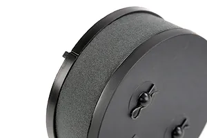 Close-up of a round black RC air filter with foam element and two R-clips on the end cap.