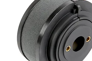 A close-up view of a black foam RC engine air filter with a plastic housing and two brass mounting eyelets.