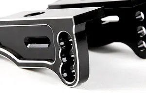Close-up of black anodized aluminium RC rear wing mounts with silver chamfered edges.