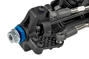 Close-up studio view of an RC car front suspension hub assembly featuring carbon fiber and metal components.