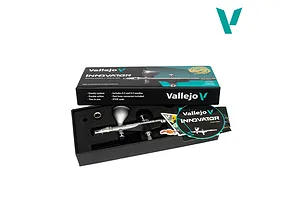Vallejo Innovator 2-in-1 precision airbrush in its retail box with lid open, showing the silver airbrush, accessories, and branding.