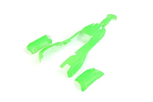 Green painted RC buggy body shell panels laid out on a clean white studio background.
