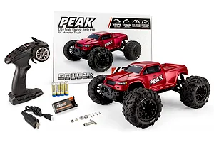 Atrek Peak 1/10 scale electric 4WD RTR RC monster truck in red with transmitter, battery, USB charger, and box.