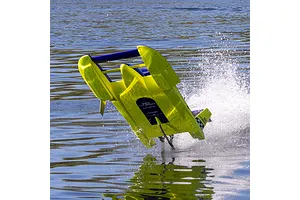 Pro Boat Miss Illinois U-34 RC boat speeding across water, creating splashes and turning sharply.