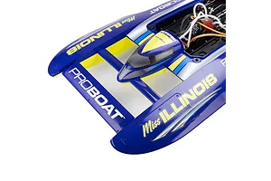 Top-down view of the Pro Boat Miss Illinois U-34 RC boat deck, showing the blue hull with yellow and silver graphics and open cockpit compartment with motor.