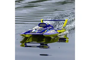 Pro Boat Miss Illinois U-34 RC boat running on water, creating a wake and reflecting on the surface.