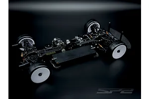 RC Maker SP2 EP 1/10 scale electric touring car chassis with carbon fibre components and white wheels.