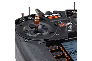 Close-up studio view of the Spektrum NX8+ 20-channel transmitter showing the gimbal, switches, and LCD screen.