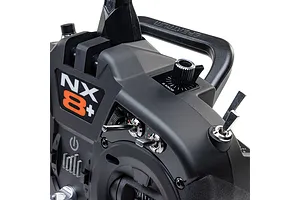 Close-up view of the Spektrum NX8+ transmitter showing switches, dials, and the NX8+ logo.