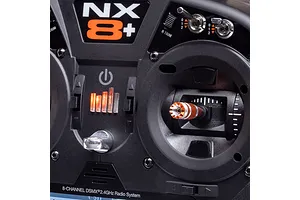 Close-up studio view of the Spektrum NX8+ transmitter faceplate showing switches, gimbal, trim tabs, and NX8+ branding.