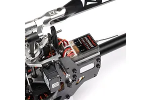 Close-up of the internal electronics and Spektrum flight controller mounted on the Blade InFusion 210 RC helicopter frame.