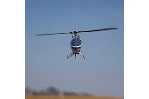 Blade InFusion 210 RC Helicopter in flight against a clear blue sky background