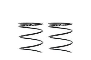 Close-up studio view of two black Kyosho 63mm big bore RC shock springs against a white background.