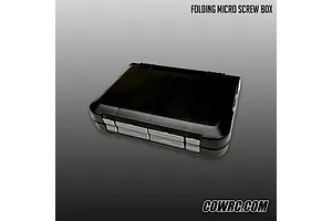 CowRC folding micro screw box closed in black plastic with clear latches on a grey gradient background.