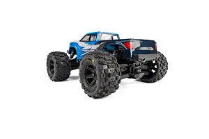 Rear three-quarter view of an RC monster truck installed with Pro-Line Badlands MX tyres on black wheels against a white background.