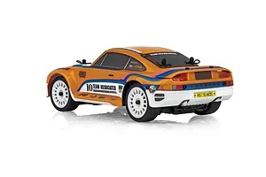 Rear-three-quarter studio view of the Team Associated RC24 Zoom RC rally car featuring orange bodywork, white multi-spoke wheels, and sponsor decals.
