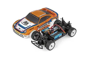 Team Associated 1/24 scale RC rally car shown with its orange and white race-liveried body shell removed from the plastic chassis.