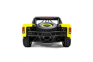 Rear view of the Losi 5IVE-T 1/5 scale short course truck showing the spare tire and roll cage against a white background.