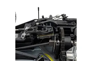 Close-up studio view of the internal chassis layout, linkages, and gear assembly of the Losi 1/5 scale RC vehicle.