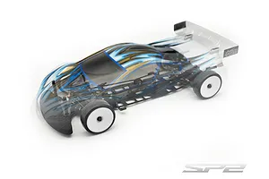 Studio shot of RC Maker SP2 EP 1/10 scale touring car chassis featuring a transparent painted body shell with blue and gold graphics.