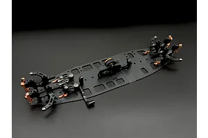 An assembled black and bronze aluminium RC car chassis with various mounted components against a dark background.