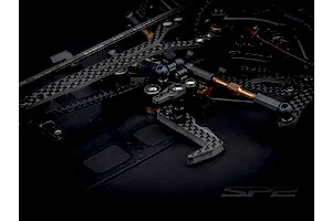 Close-up view of the aluminum chassis and carbon fiber components of the RC Maker SP2 1/10 scale touring car.