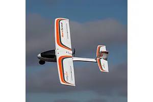 HobbyZone AeroScout S 2 RC trainer airplane flying in a clear blue sky with light clouds.