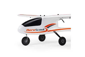 Close-up studio view of the HobbyZone AeroScout S 2 RC trainer plane, showing the fuselage, tricycle landing gear, and high wing.