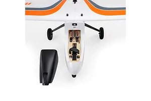 Top down view of the HobbyZone AeroScout S 2 RC plane with its battery hatch removed to show the internal compartment, electronics, and servos.