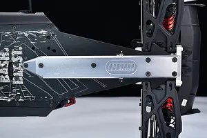 GPM aluminium rear skid plate brace installed on the chassis of an RC vehicle, showing silver metal and engraved GPM Racing logo.