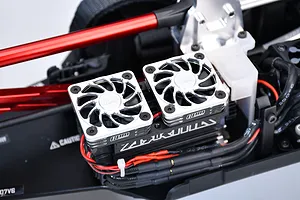 Two GPM high-speed cooling fans with silver aluminium covers mounted on an RC car motor or ESC inside a chassis.