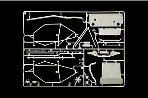 Grey plastic model kit sprue containing interior roll cage parts and chassis components against a black background.