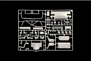 A molded white plastic model kit parts sprue featuring various car parts and accessories against a black background.