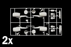 Grey plastic model sprue featuring aircraft engine parts and nacelles against a black background with a 2x indicator.