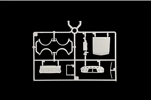 White plastic model kit sprue containing various car body parts and panels against a black background.