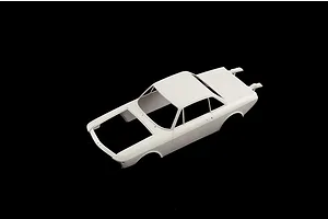 Unpainted white plastic scale model car body shell shown from a high angle view against a solid black background.