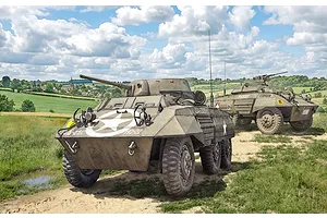 Box art illustration of Italeri 1/72 M8 Greyhound and M20 armoured military vehicles driving along a dirt path in the countryside.