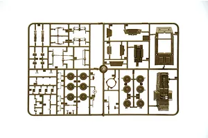 Plastic model kit sprue containing olive drab military vehicle parts on a white background.