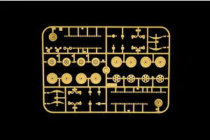 Tan plastic model sprue featuring various small parts, wheels, and suspension components for the Italeri Jagdpanzer 38(t) Hetzer model kit.