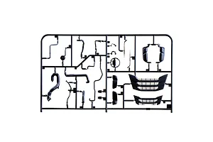 Black plastic model kit sprue containing various truck parts, mirrors, grille pieces, and pipes on a plain white background.