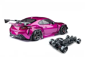 Magenta MST GR86RB RC drift car body with a large rear wing, shown alongside its black chassis against a clean white background.