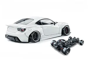 White MST 86RB RC drift car shown with a white body shell and a separate black chassis on a plain white background.