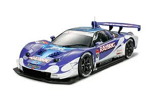 A studio shot of a completed Tamiya 1/24 scale Honda NSX 2005 Raybrig race car model kit, featuring blue and white livery with sponsor decals.