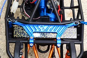 Top-down view of an RC car installed with a blue GPM aluminium upper chassis plate mounted across the frame.