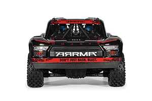 Front view of the ARRMA MOJAVE 6S 1/7 EXB black desert truck showing headlights, grille, and driver figures inside.