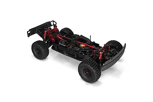 High-angle studio shot of the ARRMA MOJAVE 6S EXB RC desert truck chassis without its body, showing red aluminum braces, black electronics, and off-road tires.